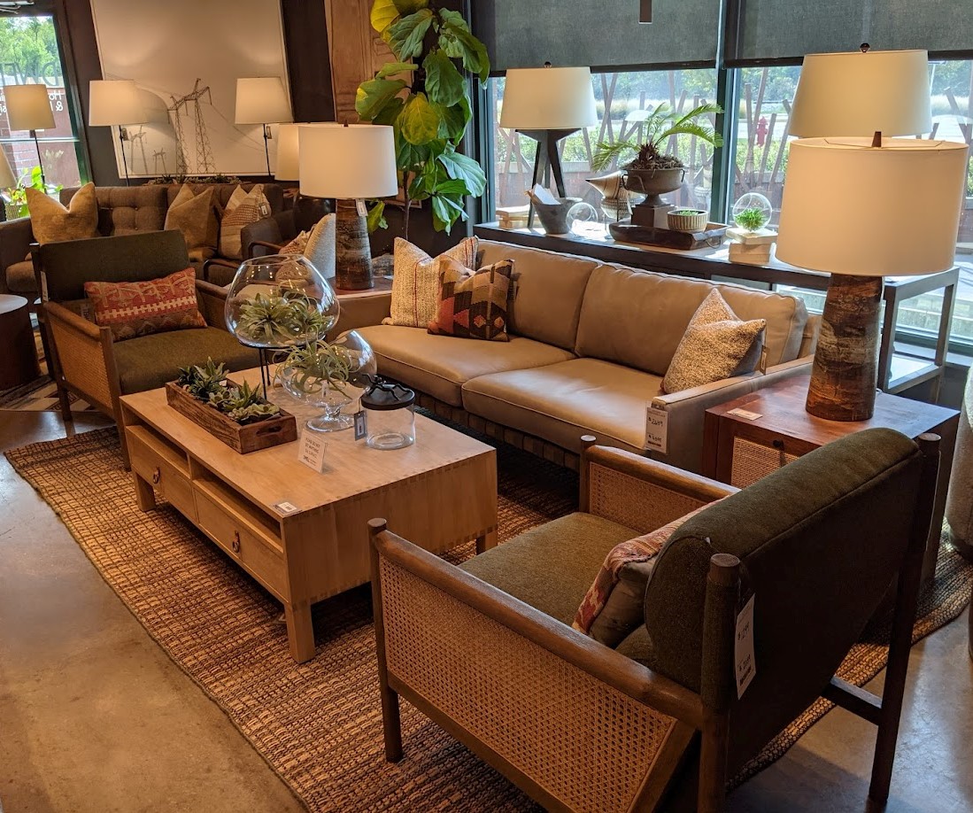 showroom set up with accent chairs and sofa